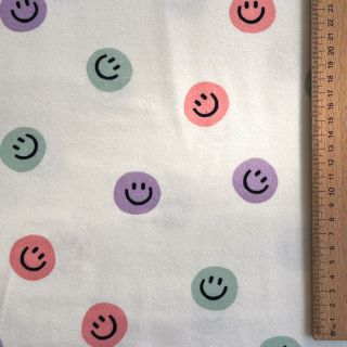 Bombažna tkanina FLANNEL Happy faces off white lilac